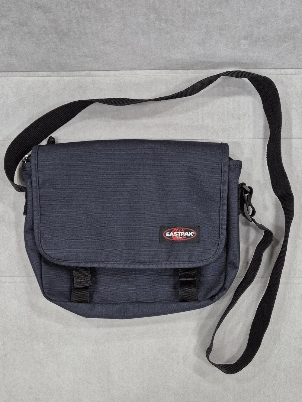 EastPak small messenger bag navy blue canvas laptop padded sleeve weatherproof